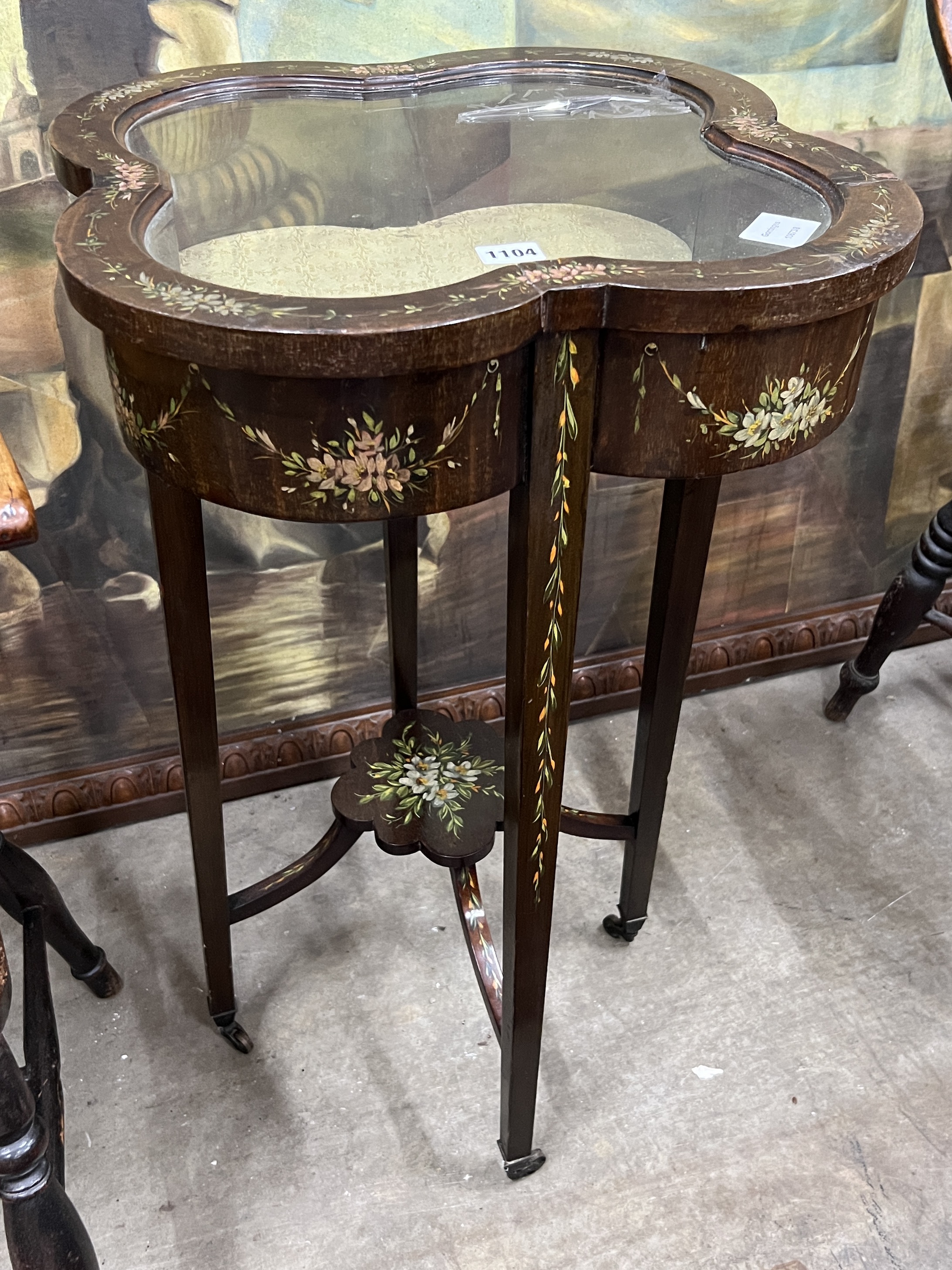 An Edwardian painted bijouterie table of lobed square form, width 44cm, height 77cm